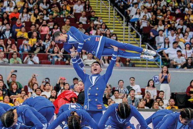 Cheering squad from the Ateneo De Manila University perform to illustrate Fee-free Philippines degrees ‘threaten the viability of the private sector’