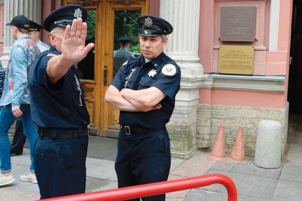 Security officers stand guard outside the US Consulate in Saint Petersburg