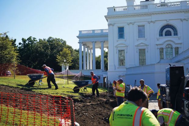 Workers are seen  outside of the Brady Briefing Room as the White House undergoes renovations  to illustrate Biden sets stricter limits on colleges making a profit