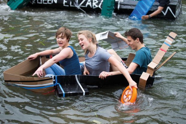 Cambridge University students  on the River Cam taking part in the cardboard boat race to celebrate the end of exams to illustrate Two-thirds of Cambridge researchers on temporary contracts