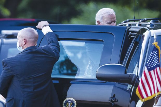 U.S. President Joe Biden gets into a vehicle with a person holding the door as a metaphor for Biden push for innovative NIH raises concern in Congress