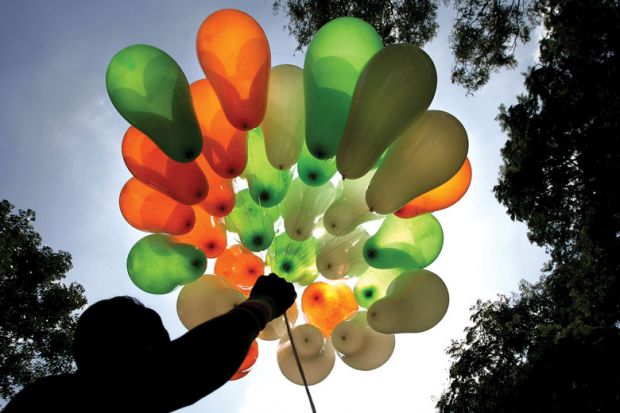A vendor displays his stock of balloons in the tri-colours of the national flag on a street in Bangalore.