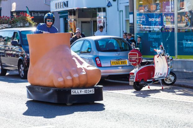 Big Foot electric vehicle with Silly Ideas number plate drives in Christchurch, Dorset UK to illustrate ‘Health sciences’ name for chiropractic college ‘misleading’