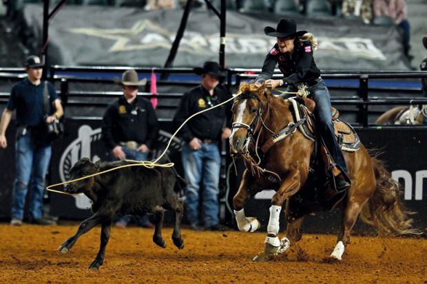 Person competes in the breakaway roping event during The American Rodeo, Texas to illustrate How Walmart founders’ donation bankrolled US private school push