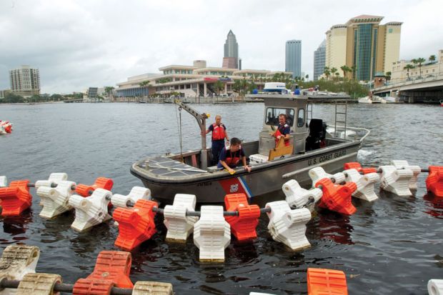  Coast Guards set up "water barriers" to restrict access under bridges near the Tampa Bay to illustrate US set to impose limits on China’s Thousand Talents programme