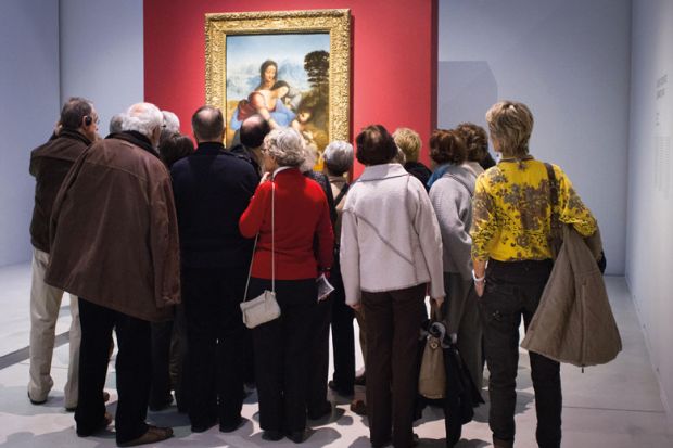  A crowd of older people view Leonardo da Vinci's The Virgin and Child with St. Anne at Louvre-Lens to illustrate Ageing workforce in non-science fields ‘not good news’ for UK