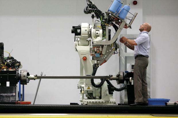 Man at machinery at the Advanced Manufacturing Research Centre.