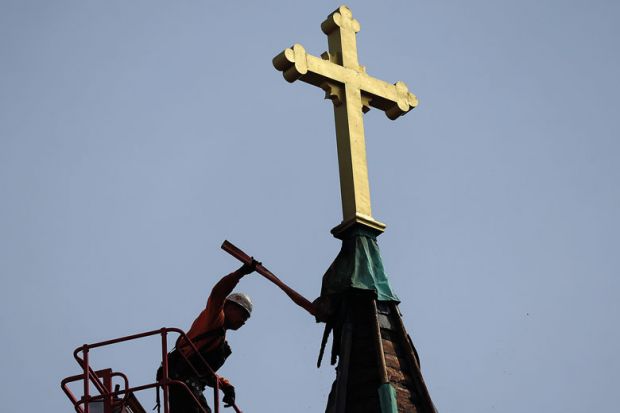 Workers began the process of removing the steeple of the Faith Lutheran Church to illustrate Doubts over future for US’ Christian colleges amid closures