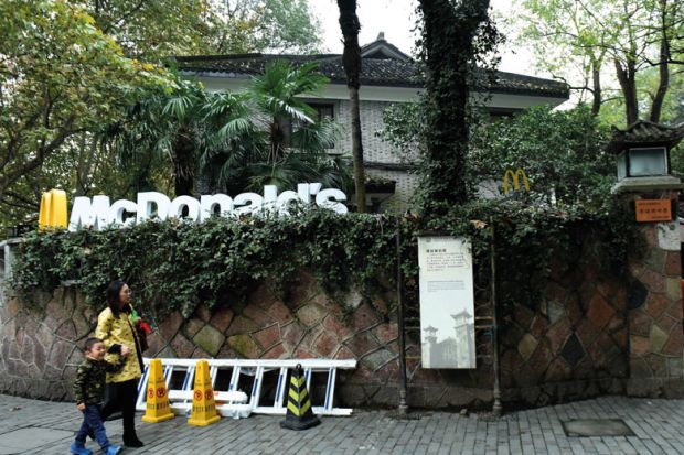 Tourists pass by a McDonald's  transformed from a house of Chiang Ching-kuo's villa to illustrate US diplomats may get research dollars to dole out in soft power bid