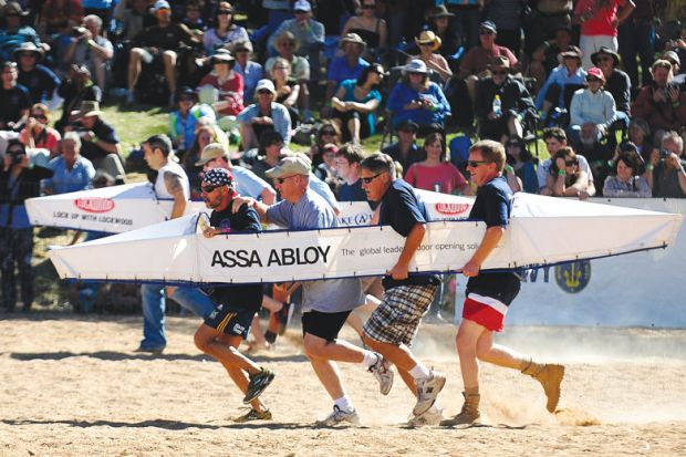 Competitors running in a in the bottomless rowing boat as a metaphor for Australian commercialisation push hampered by lack of data