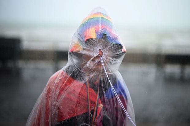 People endure the wet weather during the Brighton & Hove Pride to illustrate Queer history MA axed in bittersweet end to Goldsmiths dispute