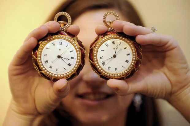 A pair of rare gold pocket watches on display to illustrate A question of timing