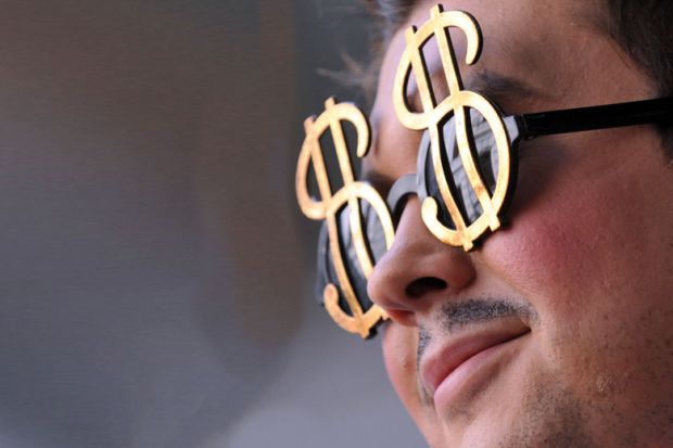 A man wears dollar shape glasses to illustrate US public universities refute claim they are amply funded
