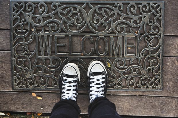 Welcome mat metaphor for scholarships incentive EU students in the UK