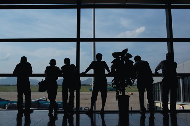 People standing at a window