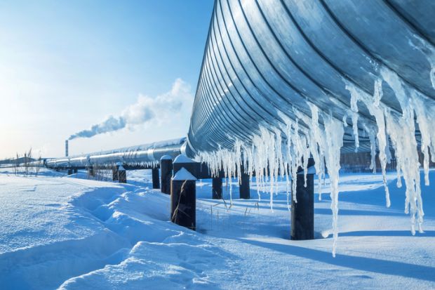 Winter landscape with icicles on the gas pipeline