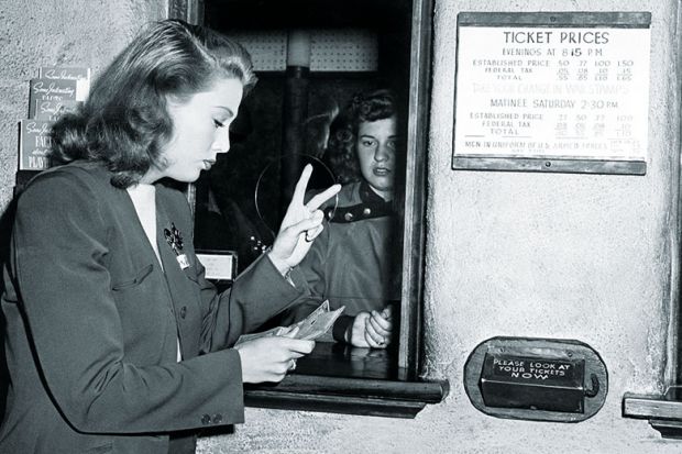 Woman buying two tickets
