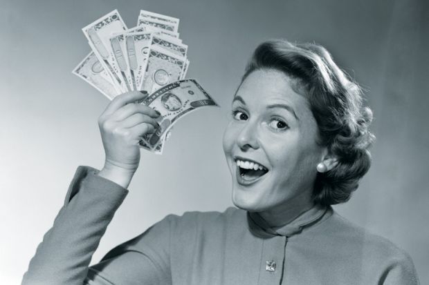 Woman holding handful of cash (black and white)