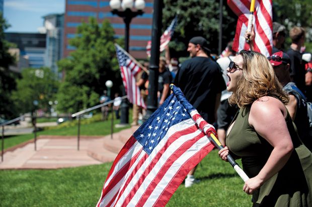 Woman shouting with American flag