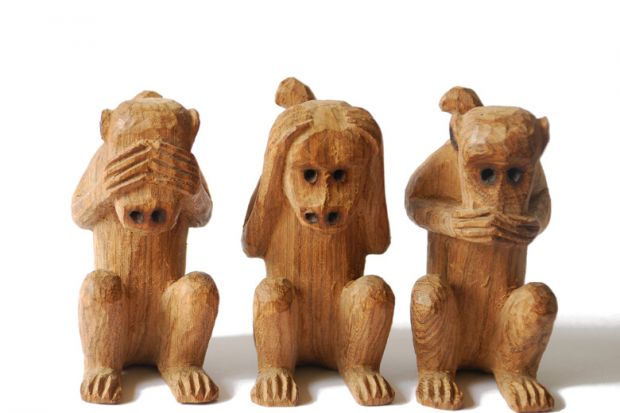 Wood-carved monkeys, see, hear, speak no evil