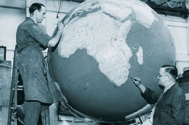 Men painting globe