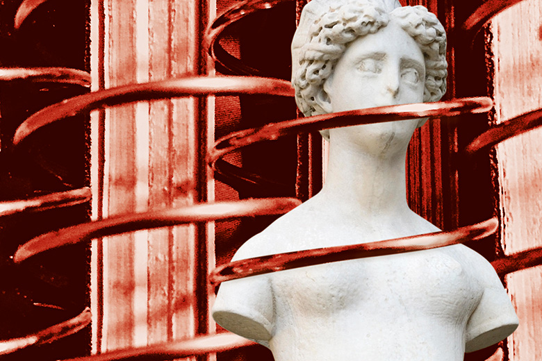 A statue wrapped in red wire