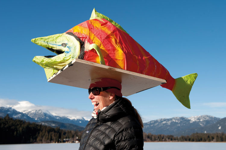 Woman with paper fish on head