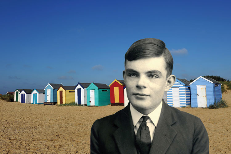 Young Alan Turing in front of beach huts